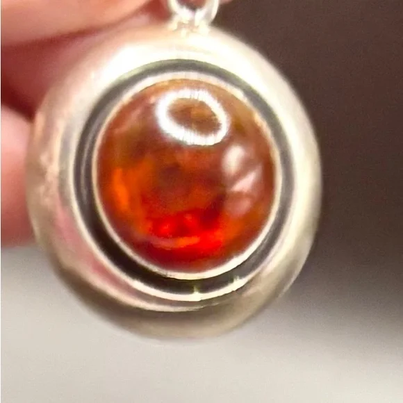 A Sterling Silver Round Pendent with a Lg Amber stone